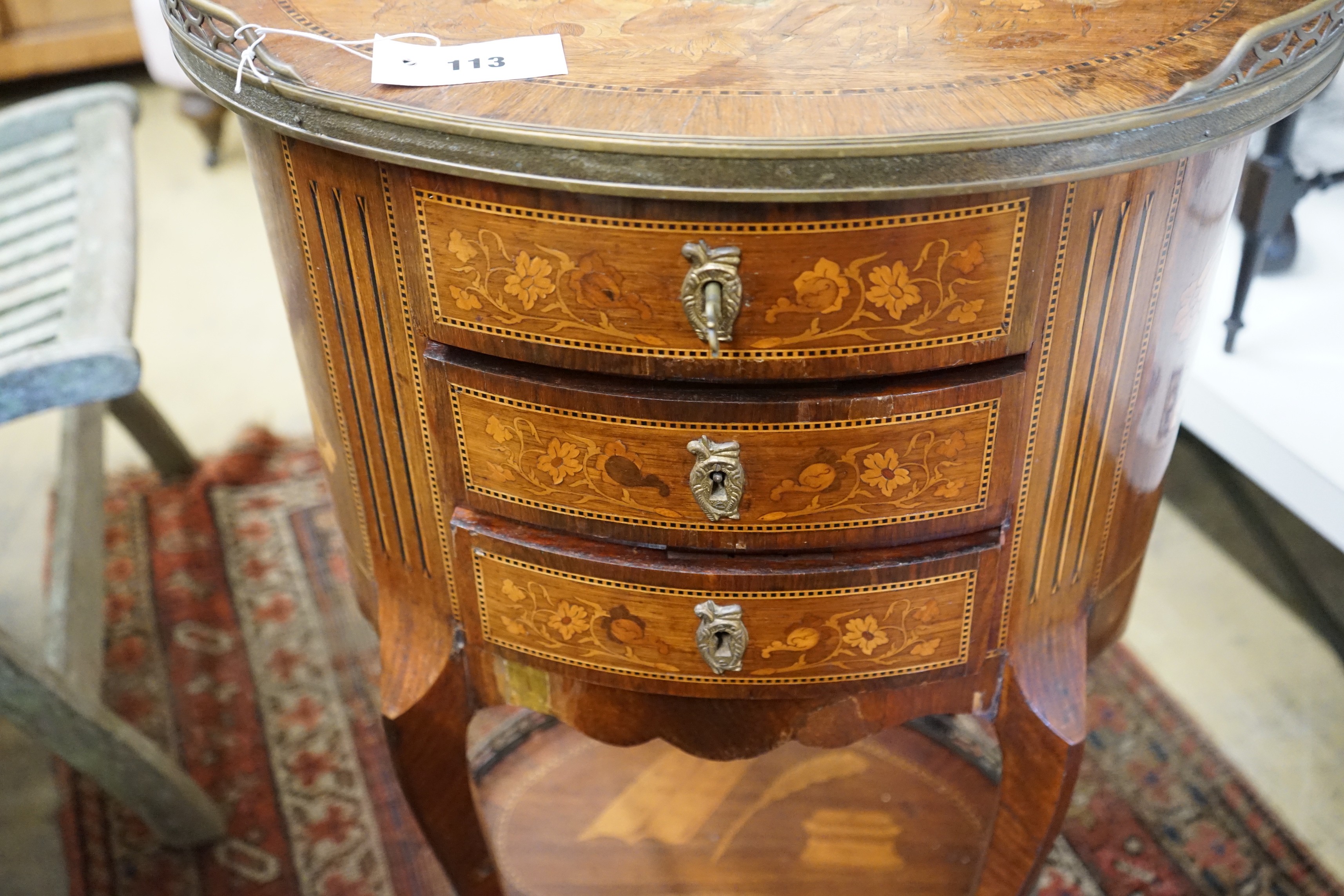 An early 20th century French marquetry oval three drawer small chest, width 50cm, depth 36cm, height 80cm